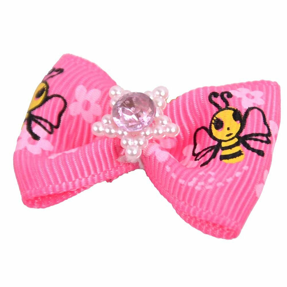Lazo para el pelo de perros con goma elástica de GogiPet, en color rosa chicle con flores, abejas y piedra brillante en medio de una estrella de perlas